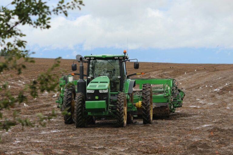 Top 5 Benefit ! What Is the Tractor Used For? 2 green tractor on plowed field under cloudy sky